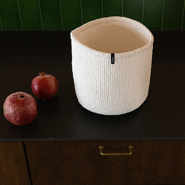 White basket on a dark table