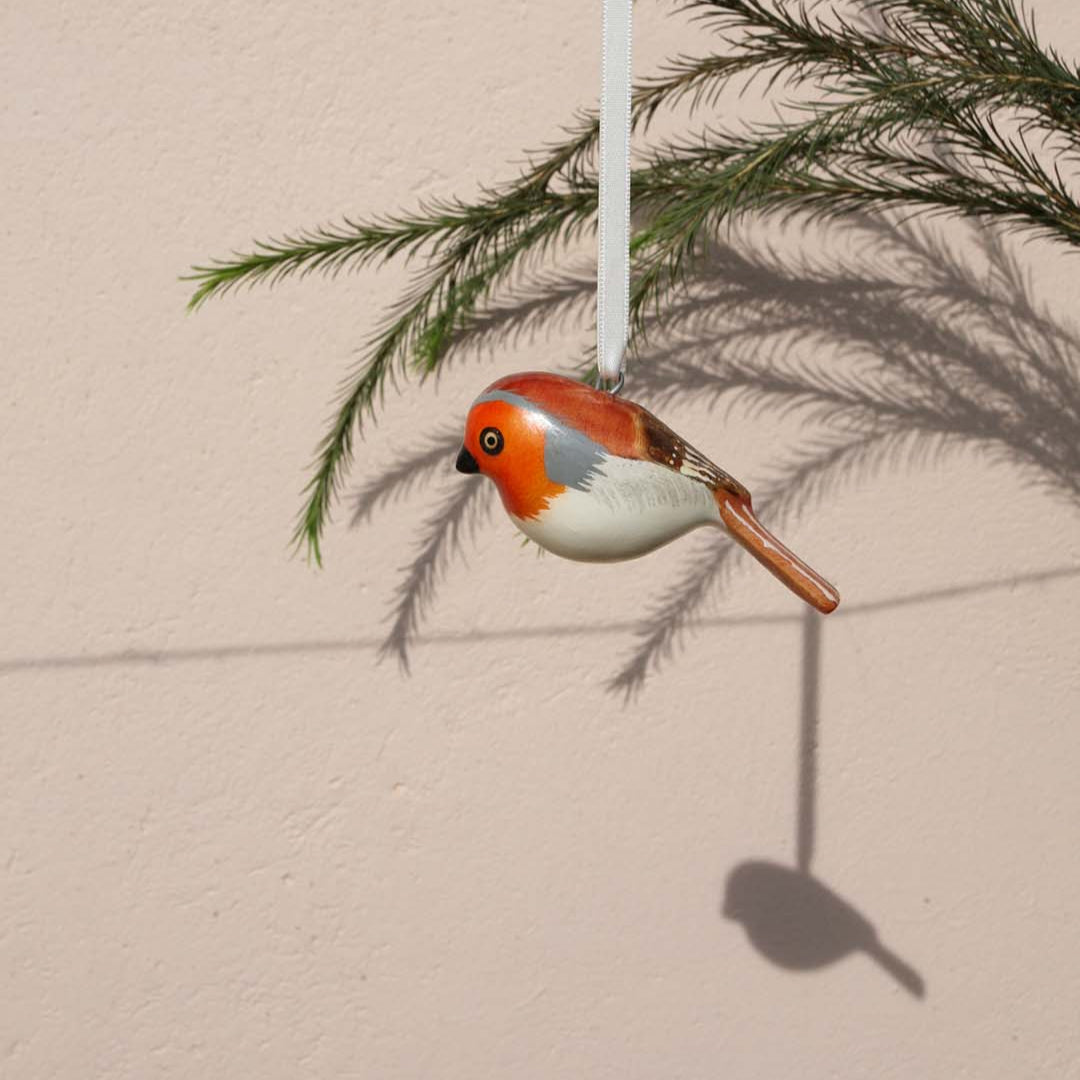 robin charming ornaments are handmade from fallen jacaranda tree branches