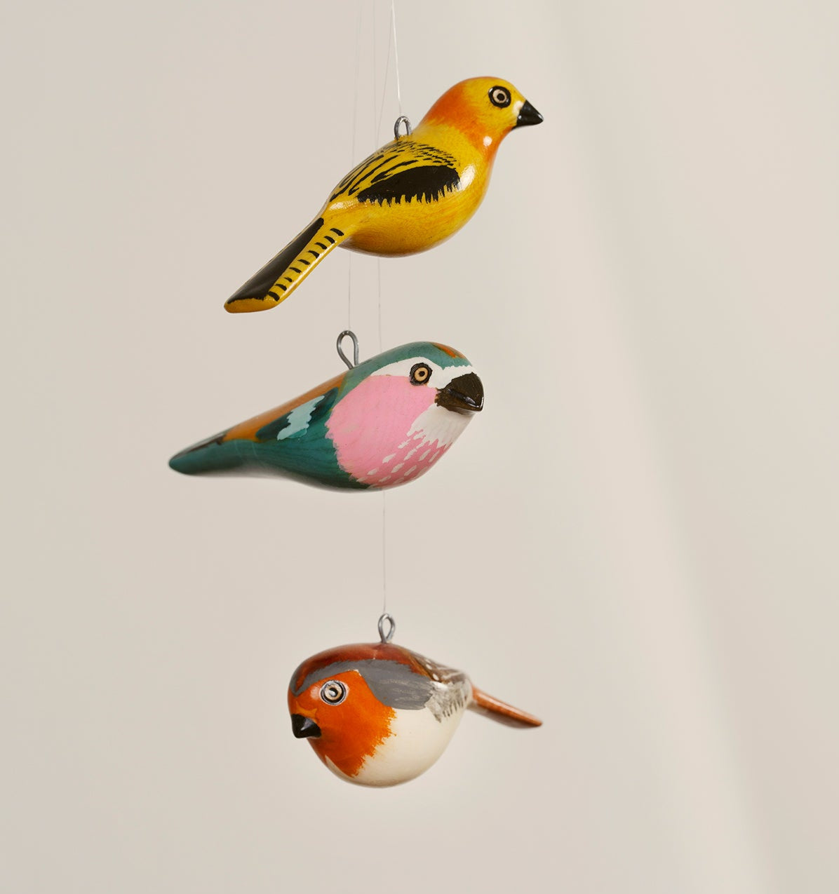 robin charming ornaments are handmade from fallen jacaranda tree branches