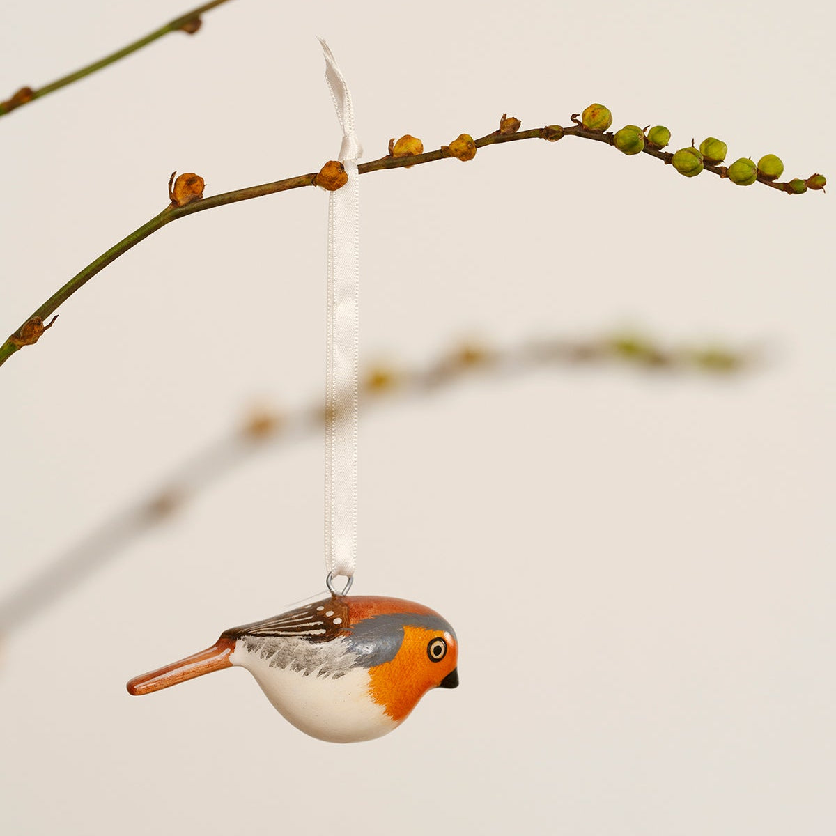 robin charming ornaments are handmade from fallen jacaranda tree branches