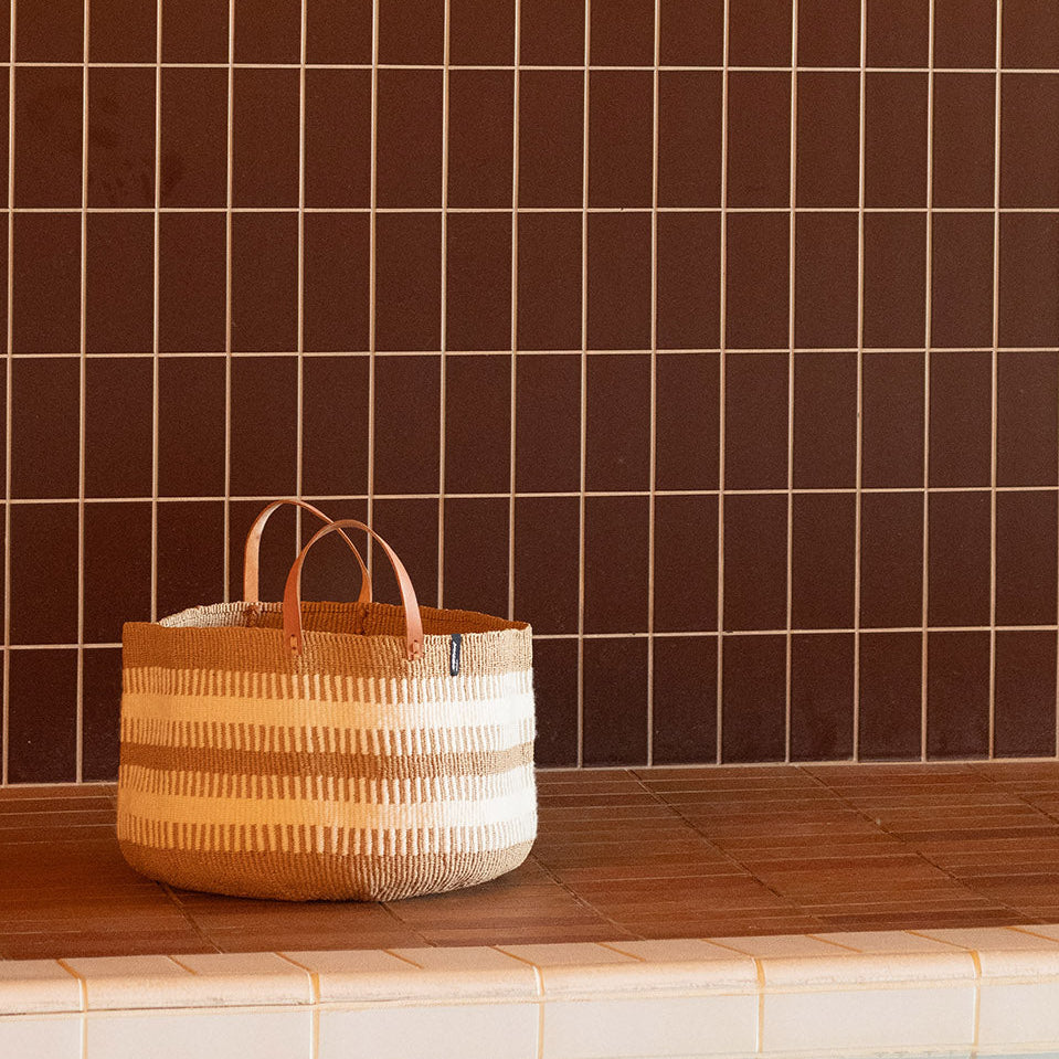 beautiful floor basket from wool and paper with leather handles