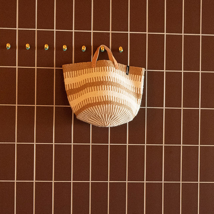 beautiful basket from wool and paper with leather handles