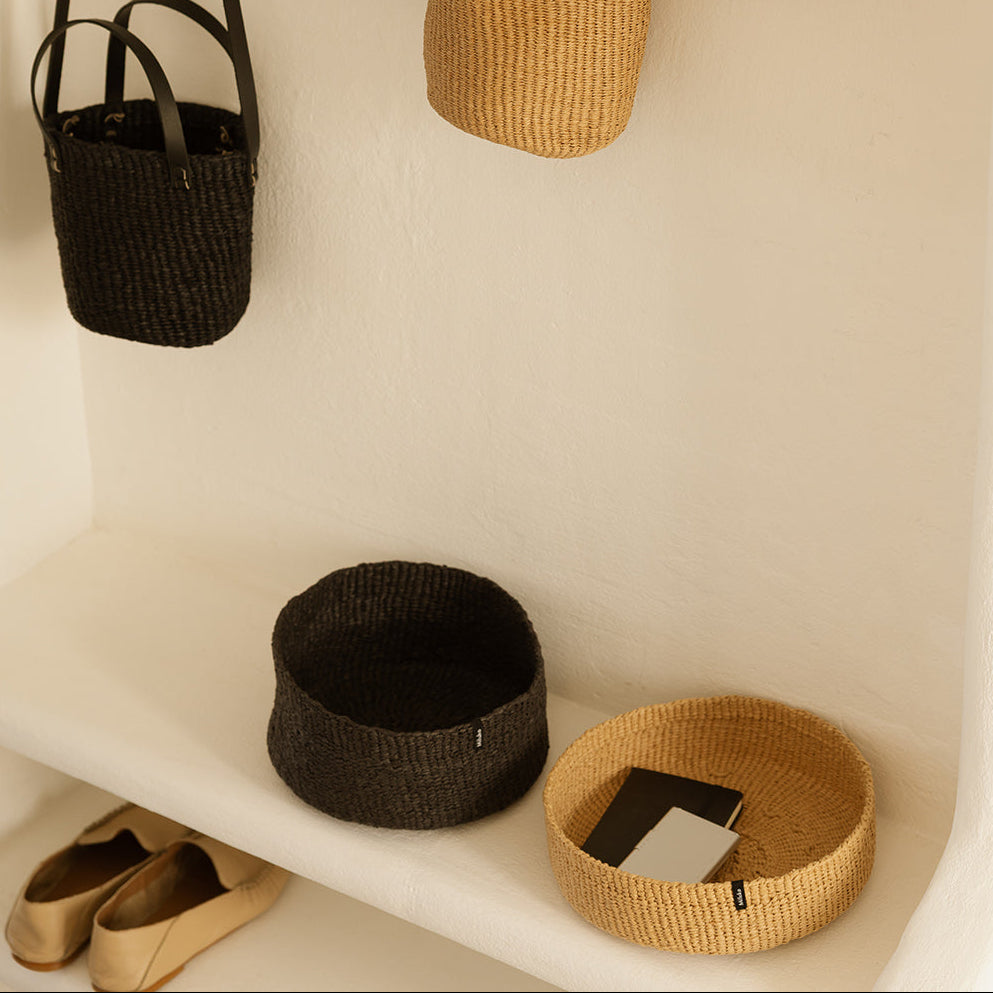 black and beige handwoven baskets