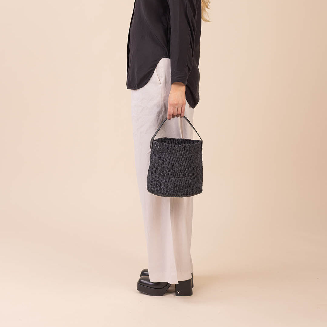 Small black basket with leather handle handmade fair trade