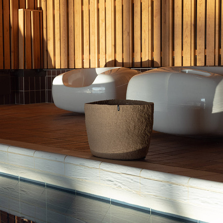 Beautiful brown basket by the pool, handmade fair trade