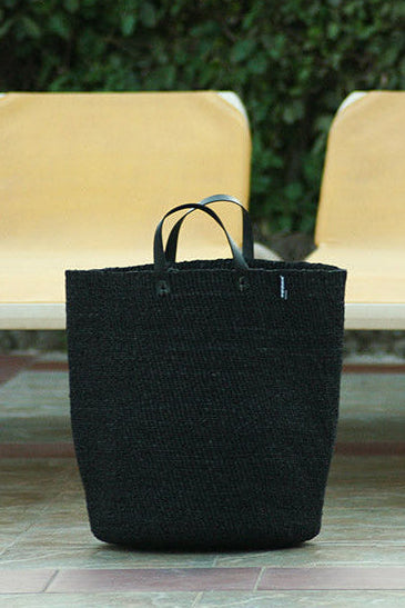 black basket by the pool