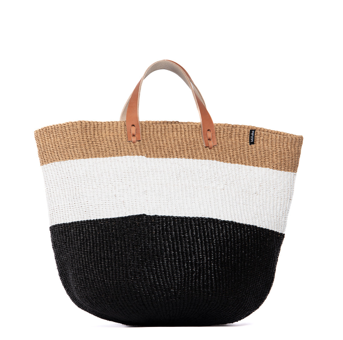 The Kiondo Market Basket in Duo Black is a stylish and sustainable accessory that combines functionality and modern design. Handwoven with care by skilled artisans, this medium-sized basket is crafted from a durable blend of FSC-certified paper and recycled plastic, making it lightweight, robust, and eco-friendly.