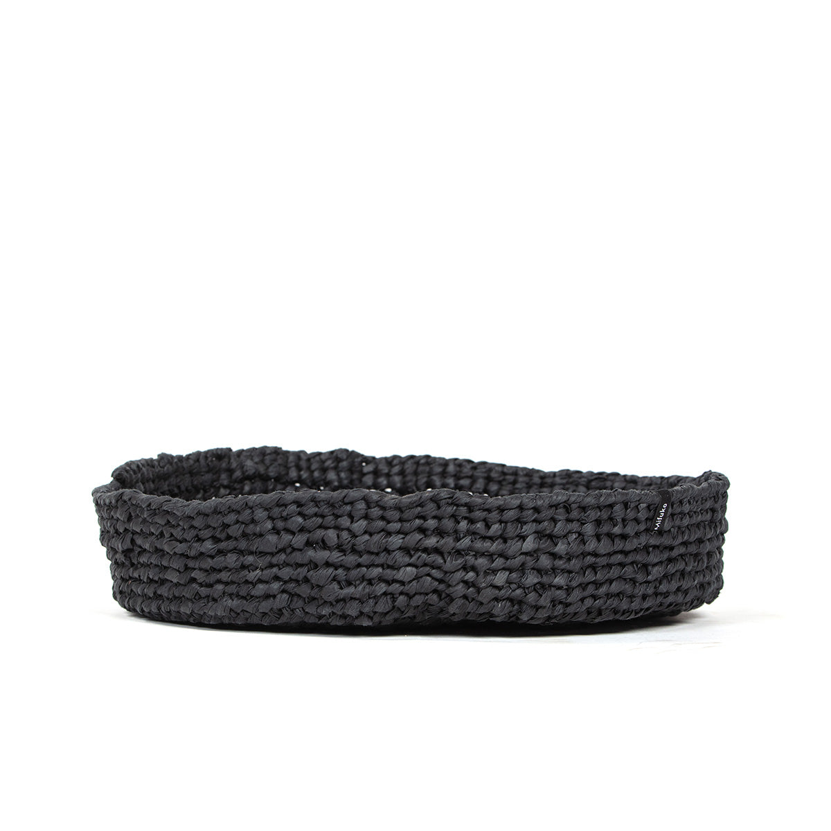 The Kiondo Bowl in Black is a beautifully handwoven piece that combines traditional craftsmanship with a sleek, modern design. Made from a durable blend of FSC-certified paper and recycled plastic, this medium-sized bowl is lightweight, strong, and eco-friendly.