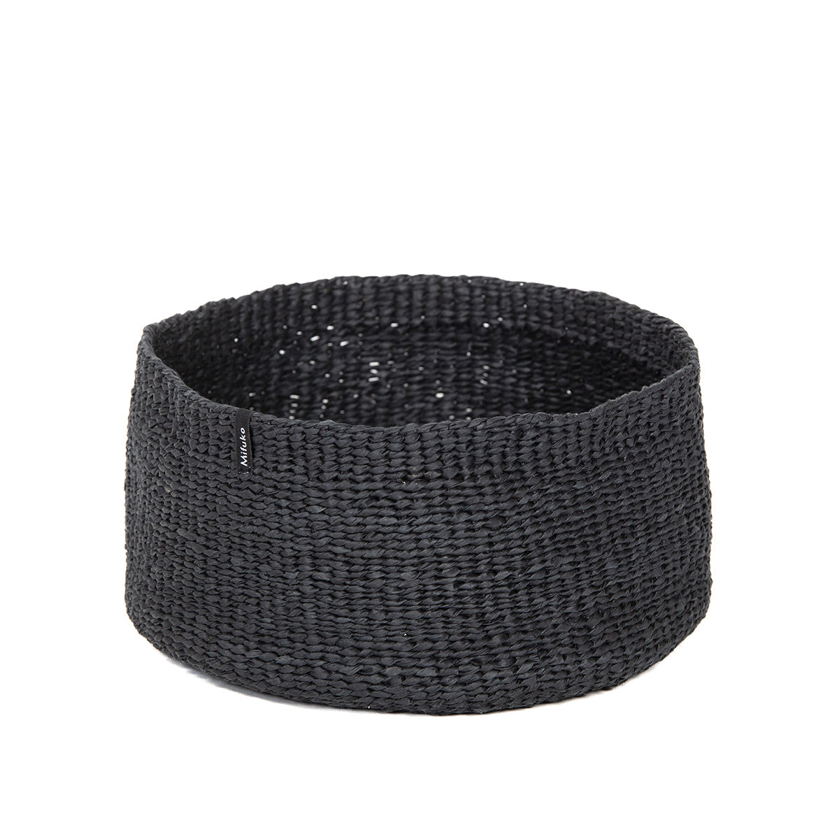 The Kiondo High Bowl in Black is a stunning and practical piece, designed for organizing small items in a sleek and sustainable way. Handwoven from FSC-certified paper, this small bowl is lightweight yet sturdy, combining eco-friendly materials with elegant design.