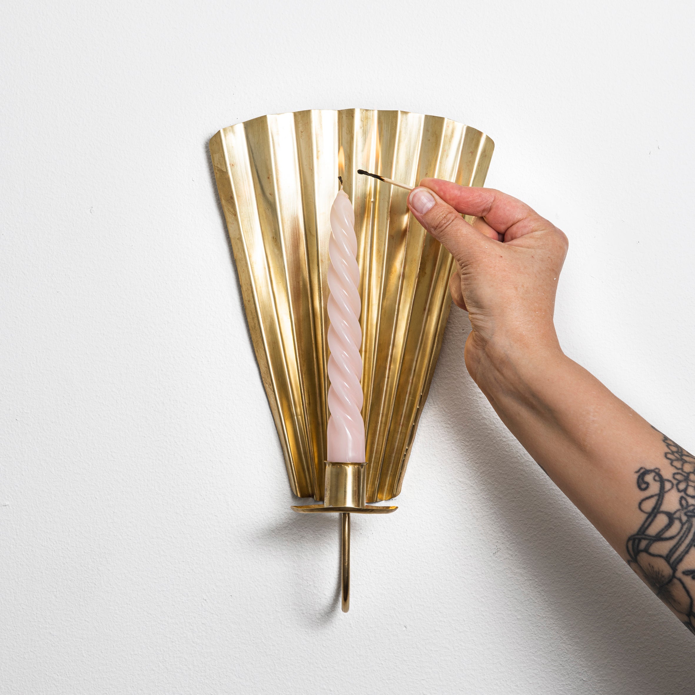 Brass wall sconce by Mifuko.