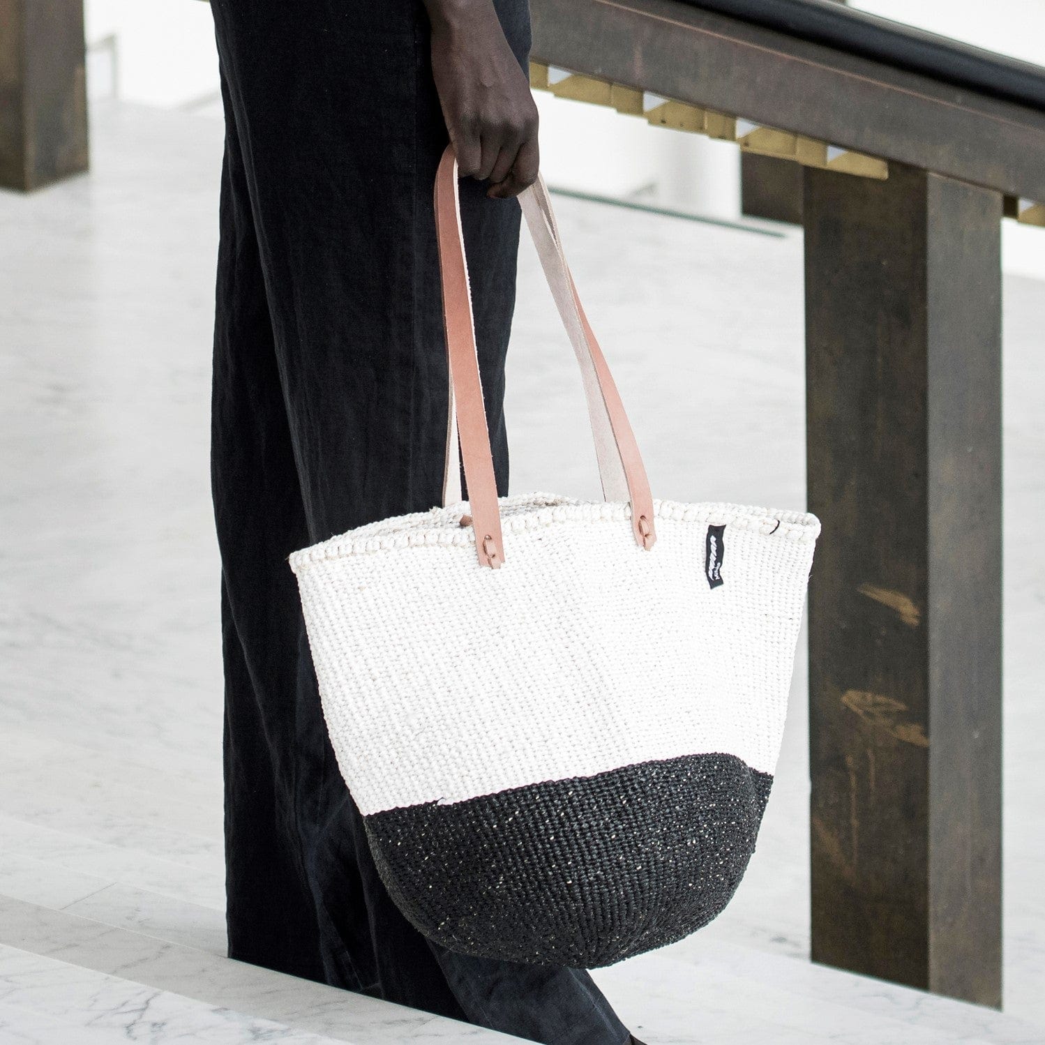 Mifuko Partly recycled plastic and sisal Shopper basket M Kiondo shopper basket | Black and white duo M handmade fair
trade leather handles