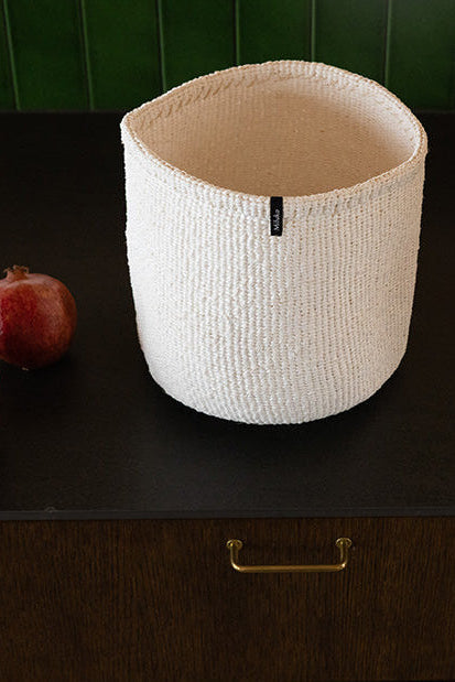 White basket on a dark table