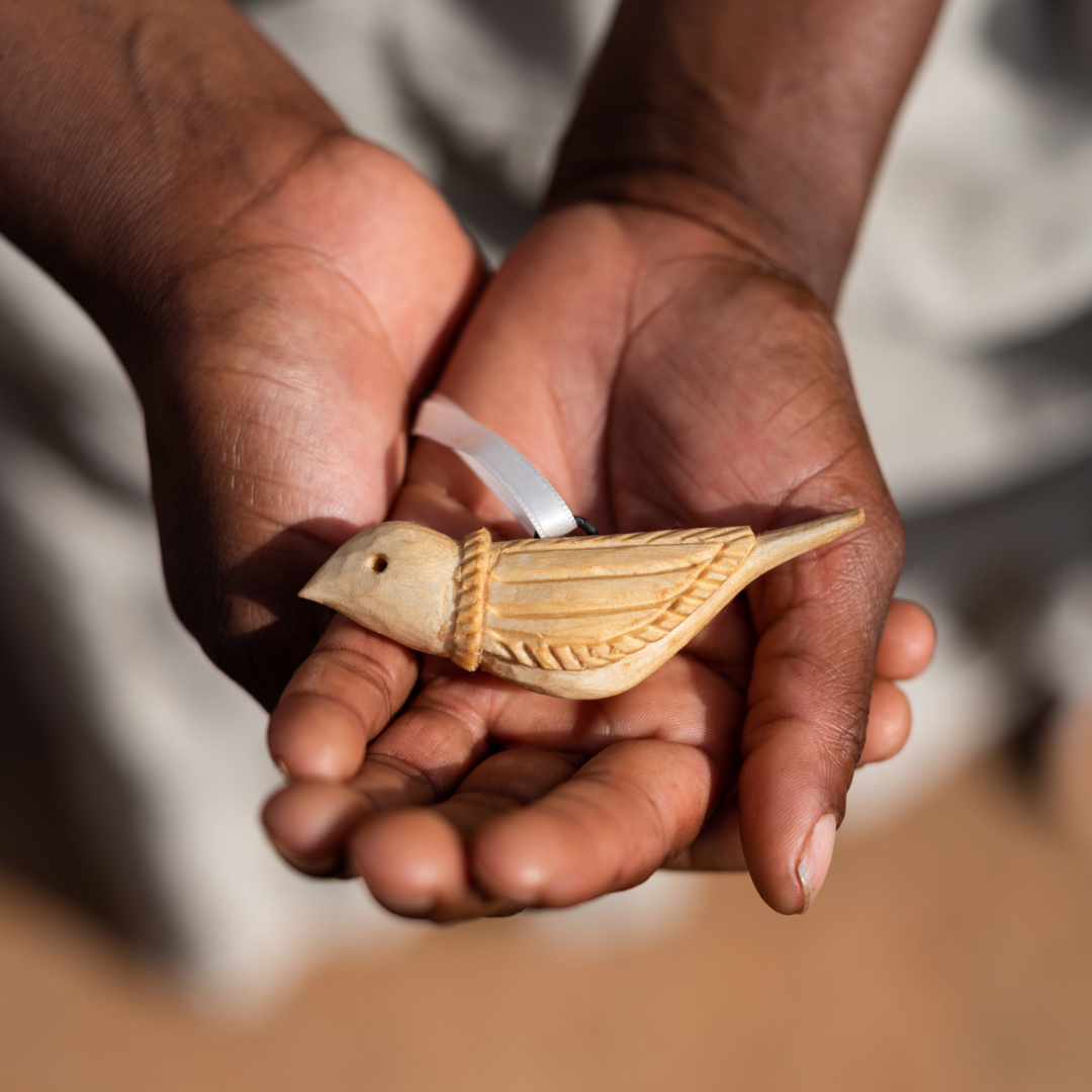 Hand carved wooden bird ornament by Mifuko