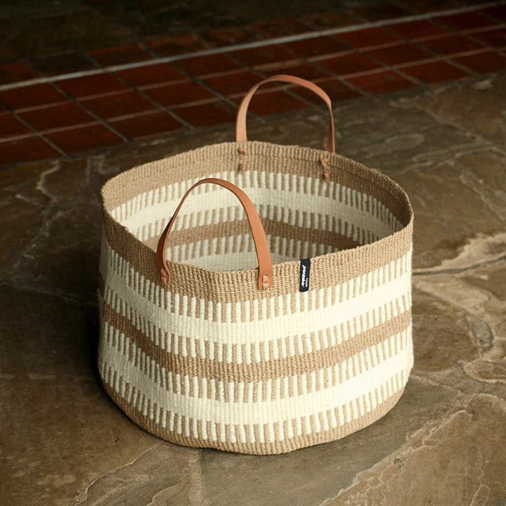 beautiful floor basket from wool and paper with leather handles