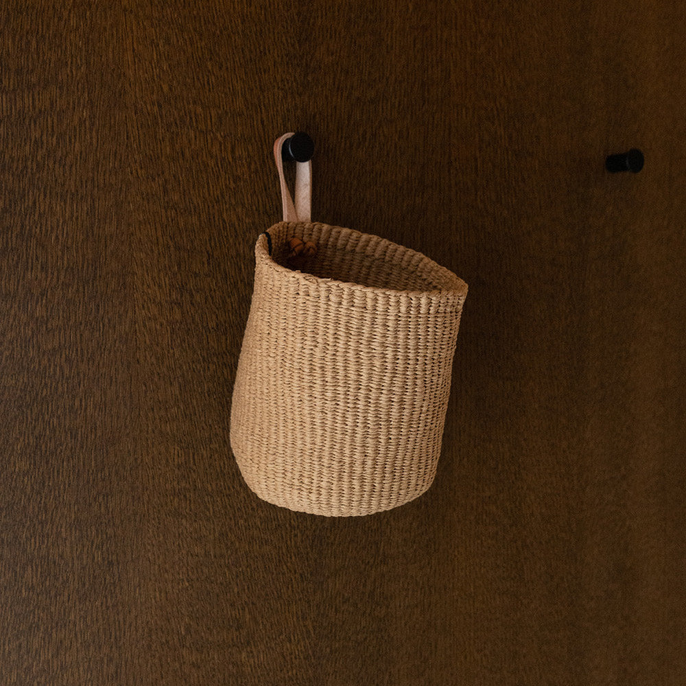 brown small basket in a hook