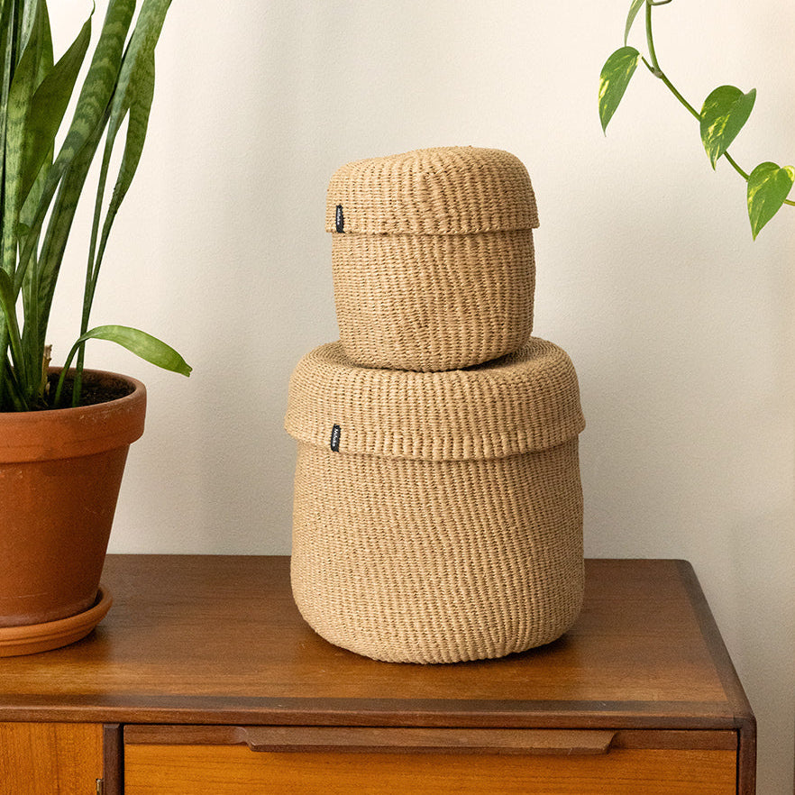 Two baskets with lids piled