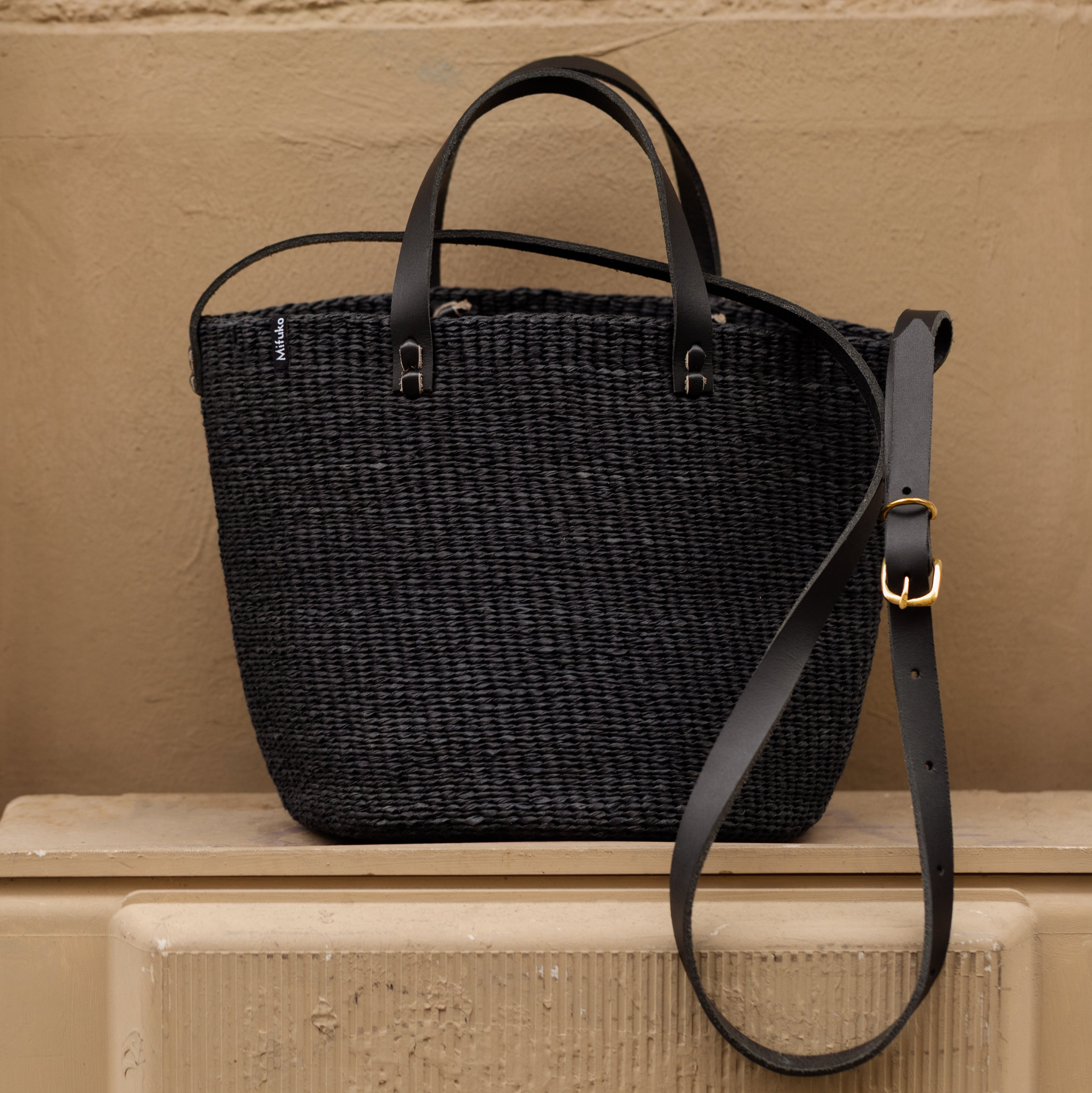 Black handwoven handbag with leather straps fair trade