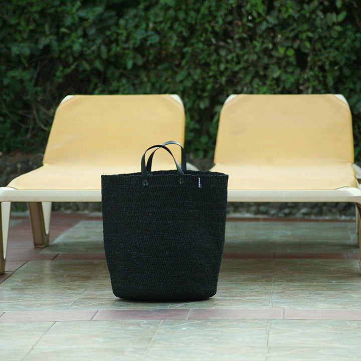 black basket by the pool