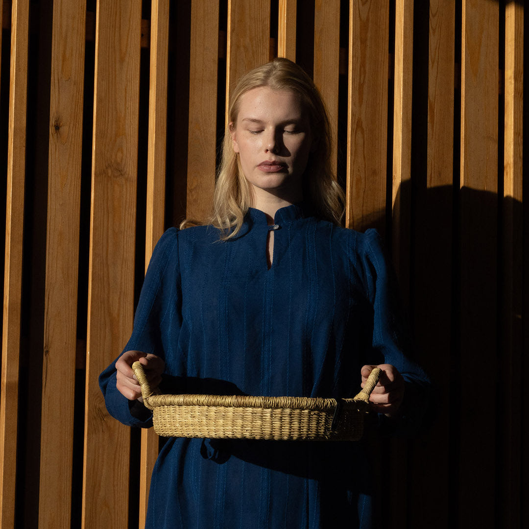 Woman holding beautiful natural bowl handmade fair trade in a evening light