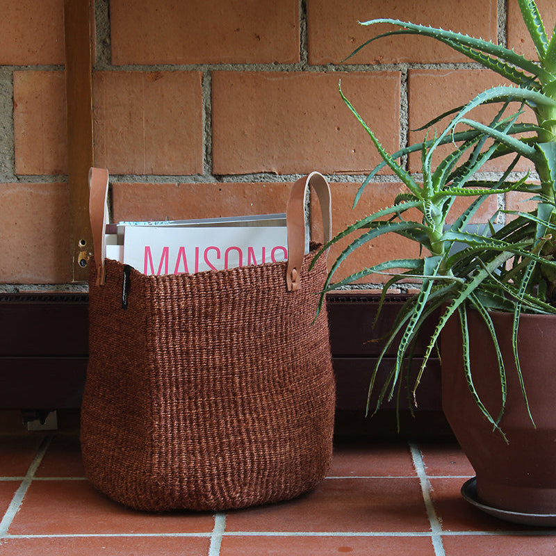 Beautiful dark brown sisal basket with plant