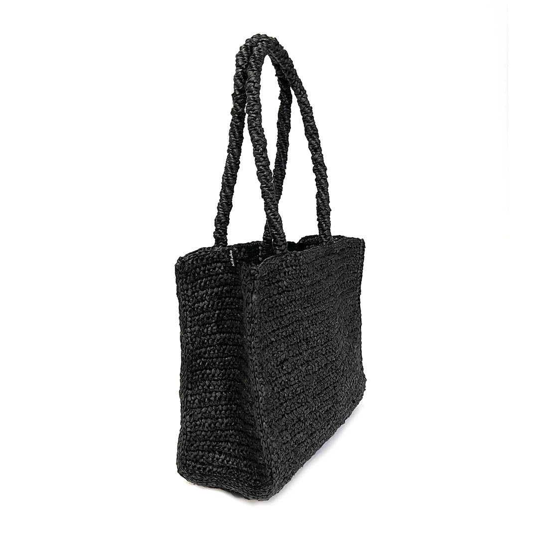 Black crocheted handbag on a white background handmade fair trade