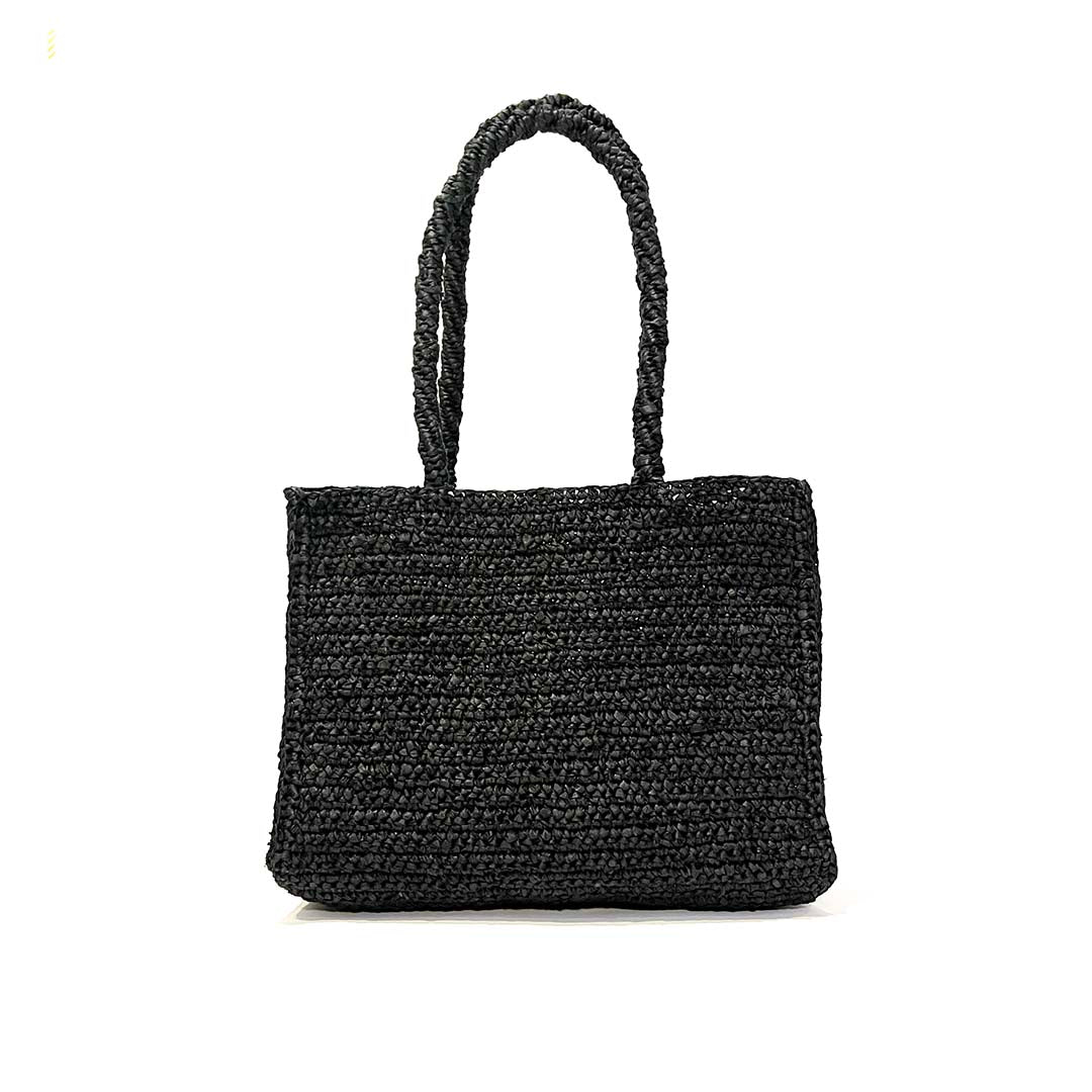 Black crocheted handbag on a white background handmade fair trade